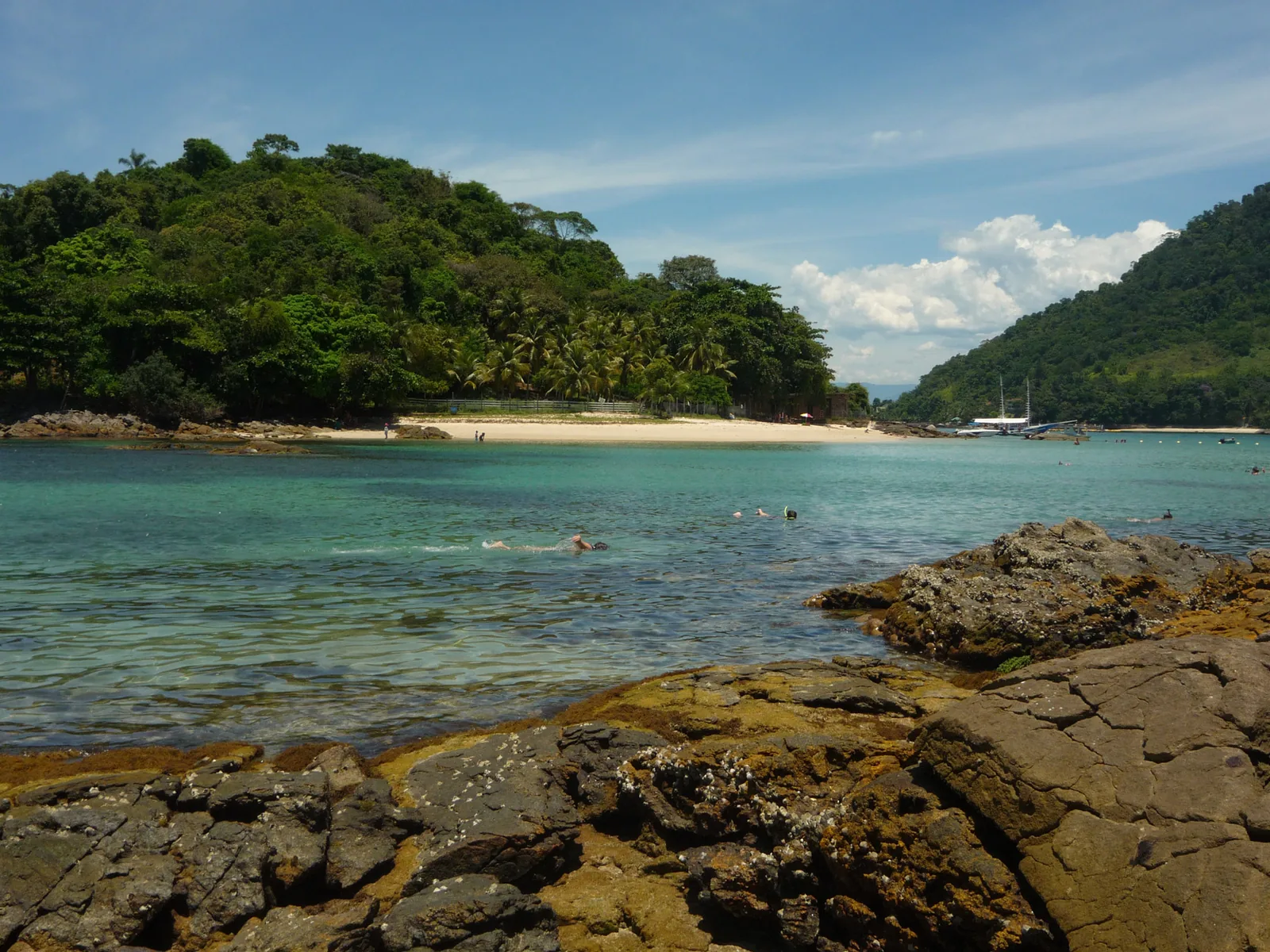 Angra dos Reis and its scatter of islands, one of the three shorelines visible from a single deck.