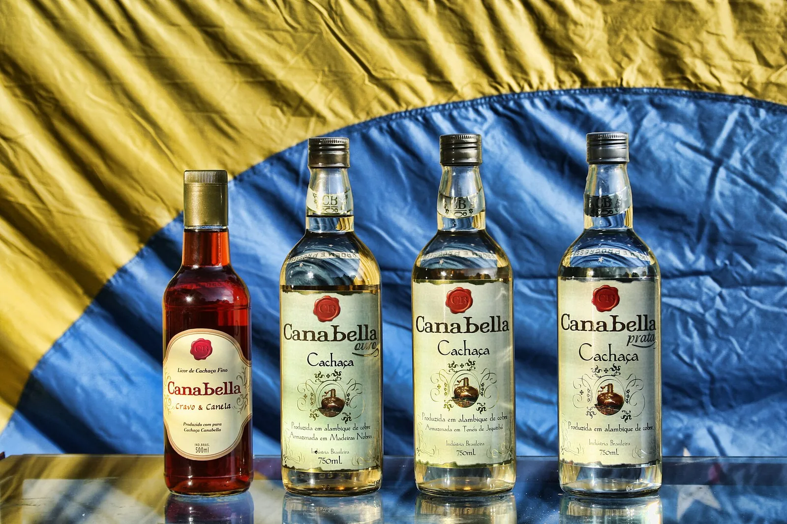 Bottles from an artisanal still — cachaça is the spirit that anchors a Brazilian table.