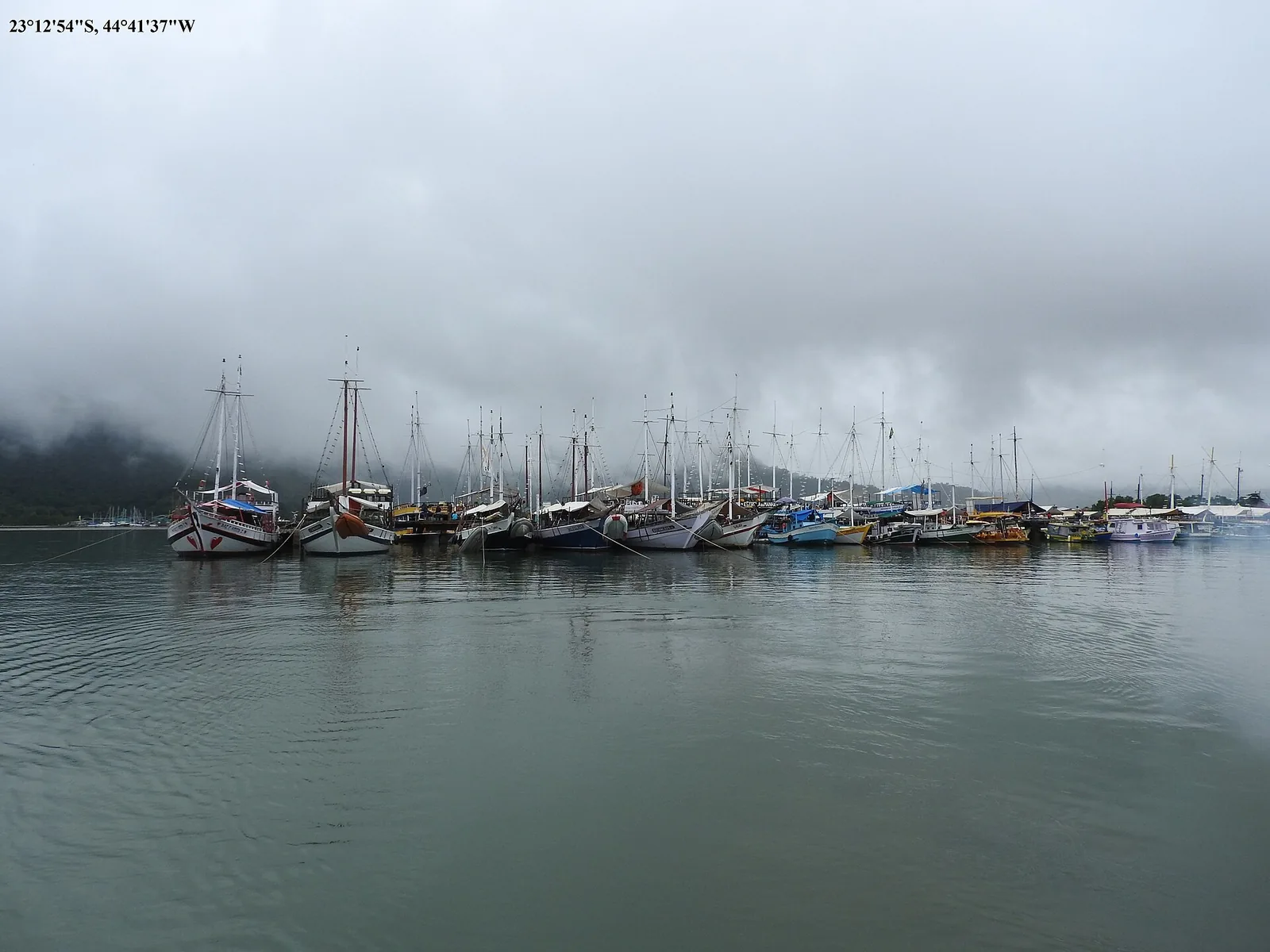 Calm, sheltered water inside the bay — the kind of cove a boat day stops at for swimming and snorkelling.