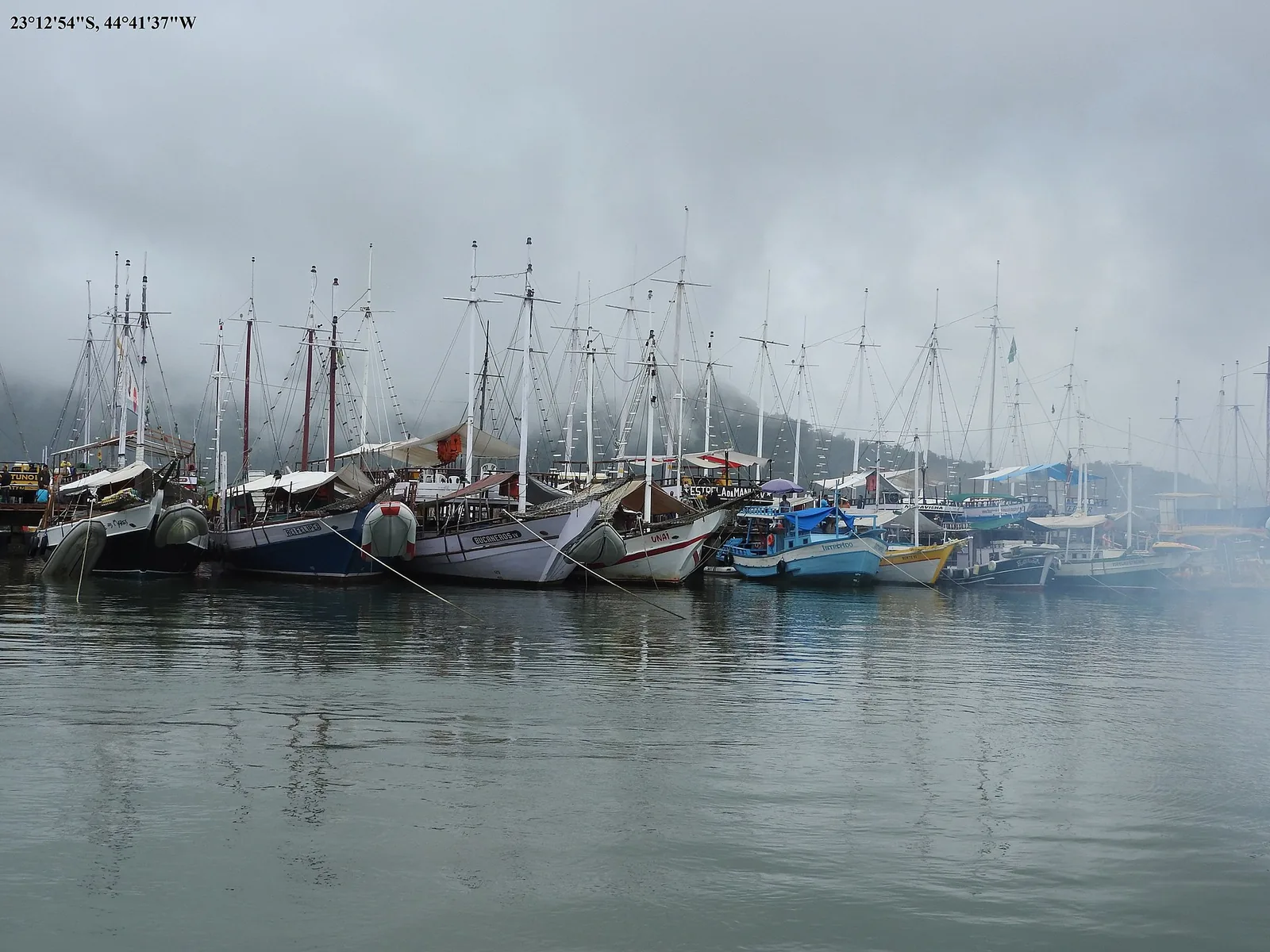 A lancha idling off one of the bay's inner islands, the classic Paraty day-charter set-up.