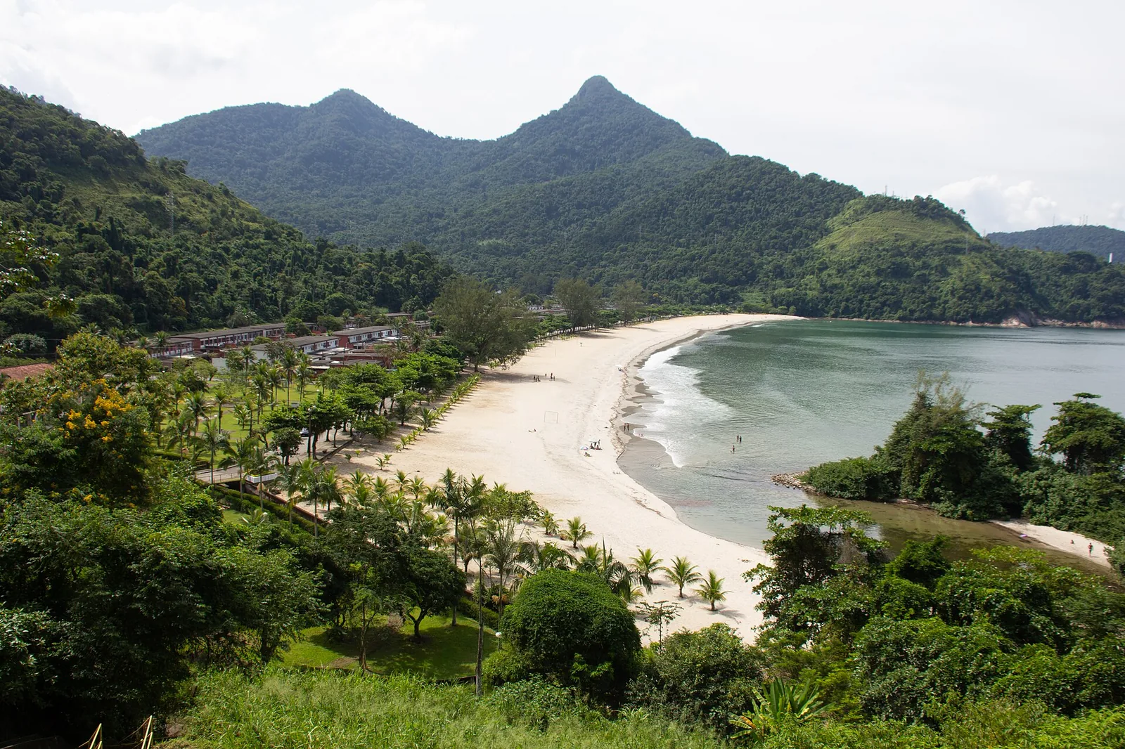 Forest meeting sand on the Paraty coast, where the Serra do Mar drops almost to the waterline.