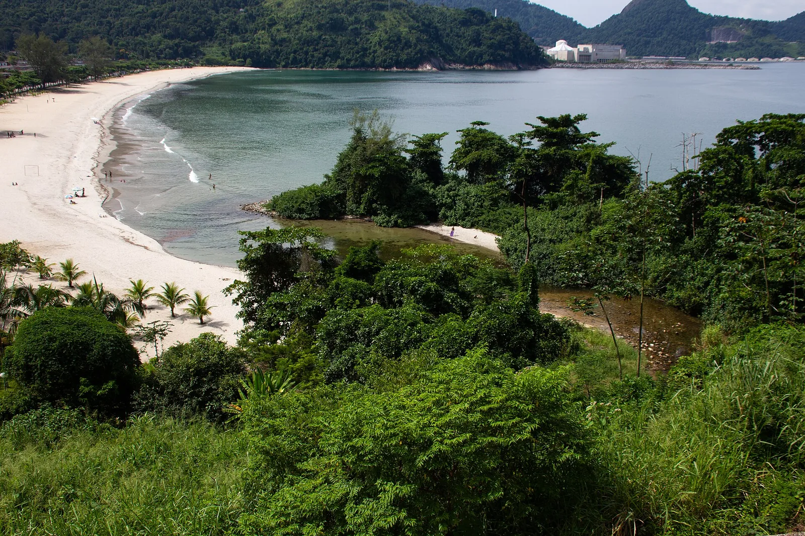 Forest meeting sea on the Paraty coast — the landscape all three of the region's traditional peoples have shaped.