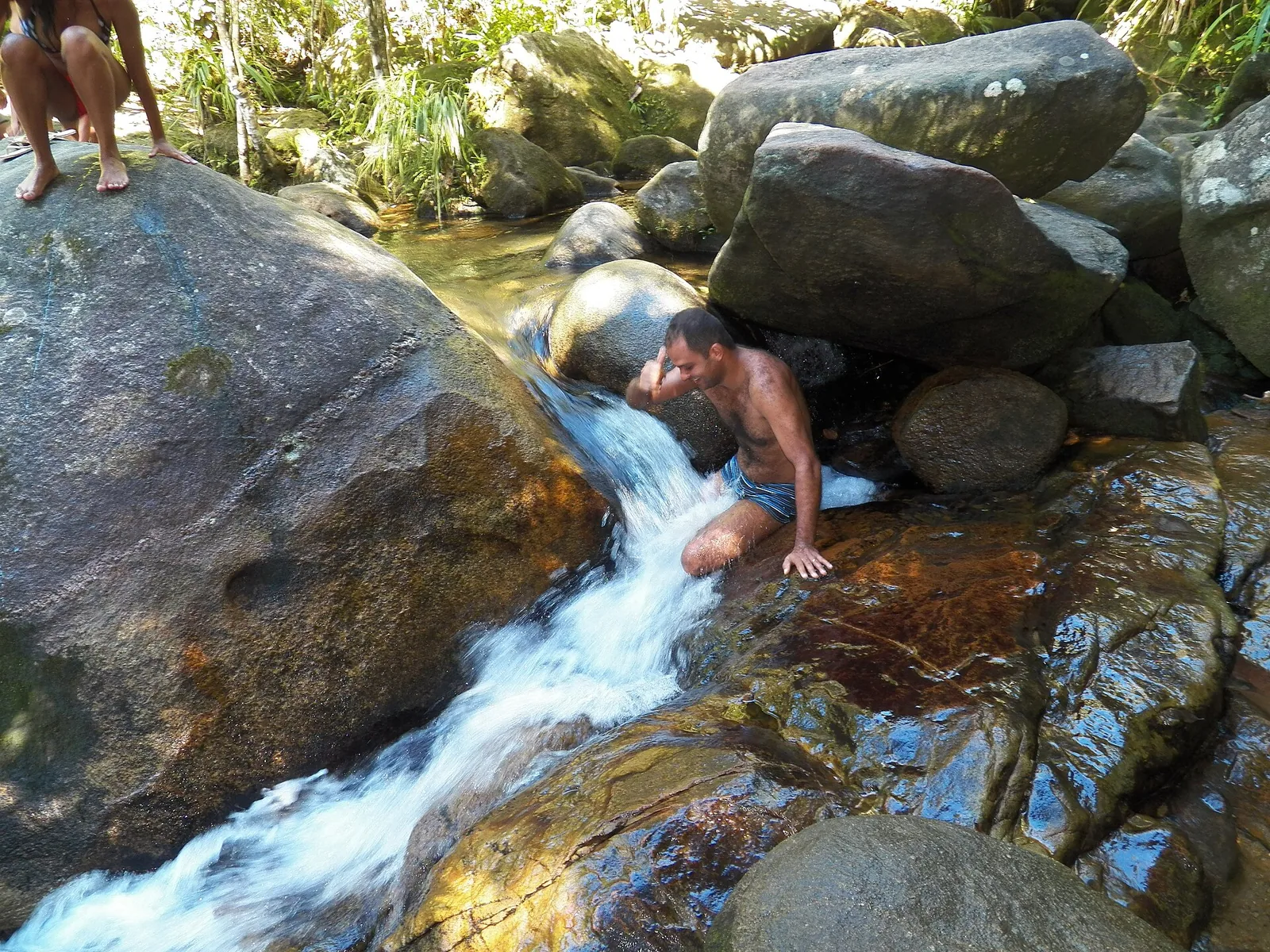 The natural pool at Trindade, where rock walls calm the sea into a shallow, fish-filled aquarium.