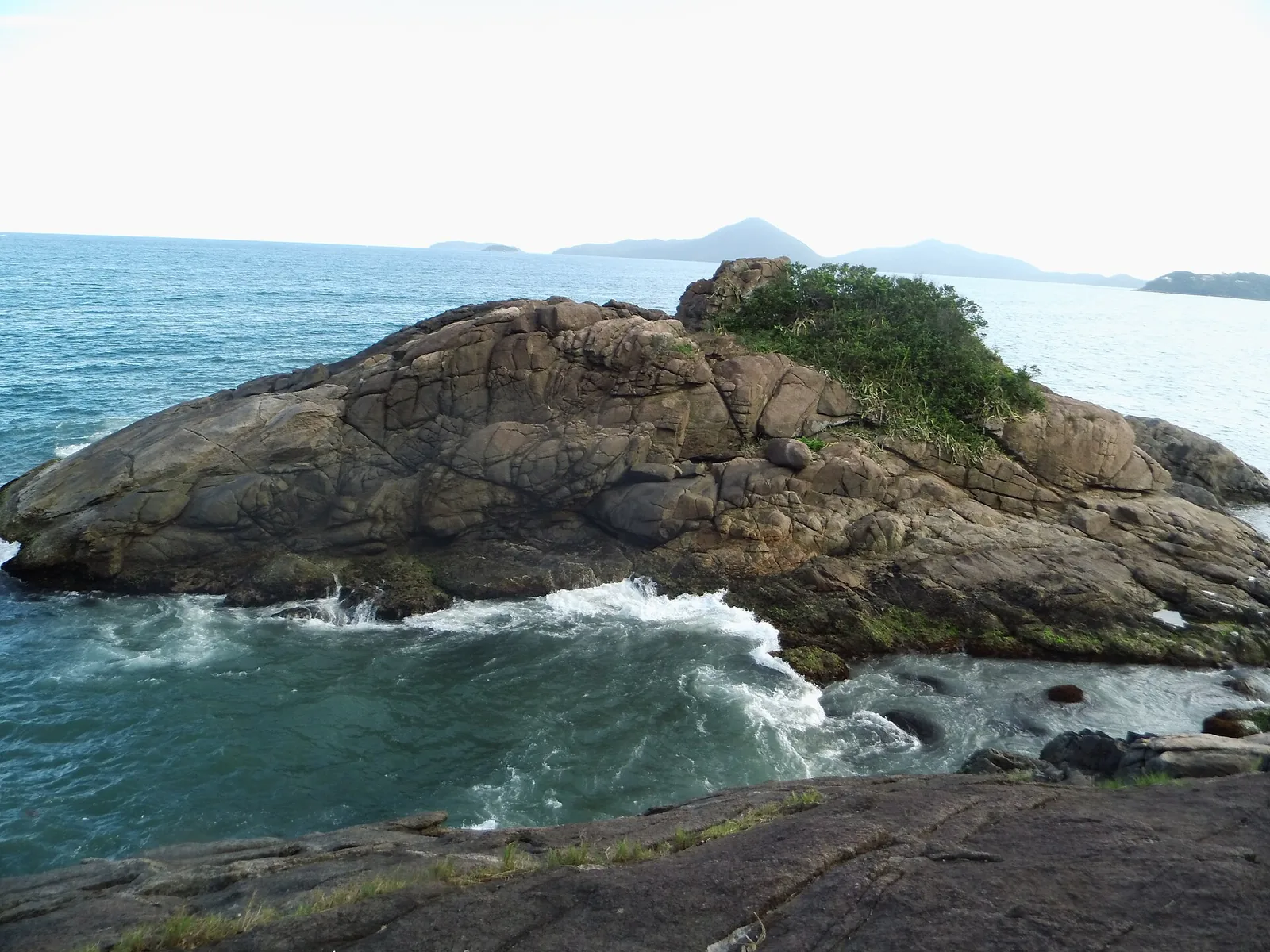 Praia Grande, the long town-side beach — surf at one end, calm swimming along the middle.
