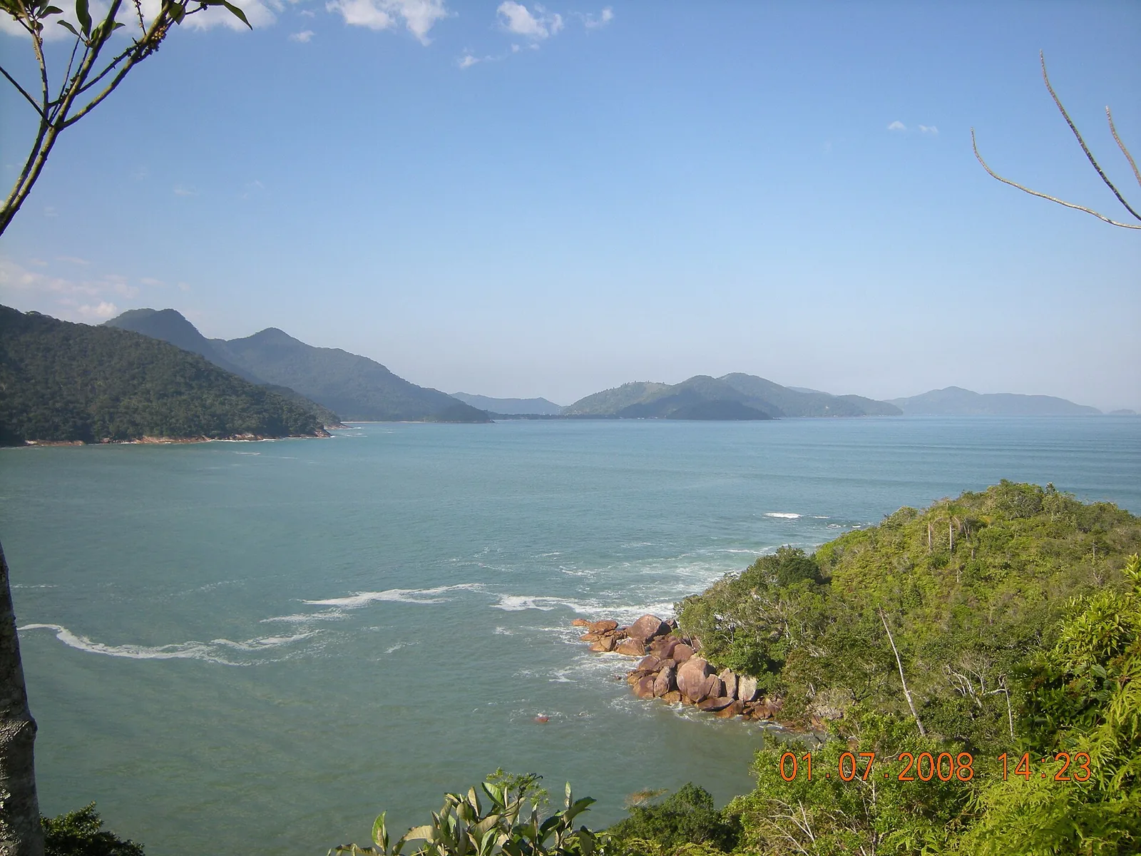 The Atlantic-forest backdrop that gives the Costa Verde its name, rising straight behind the beaches.